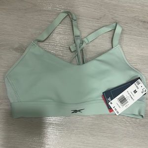 brand new Reebok lux strapped sports bra